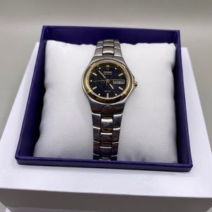 Citizen Solar Eco-Drive Watch Women Silver
Gold Tone Round E000-K17578